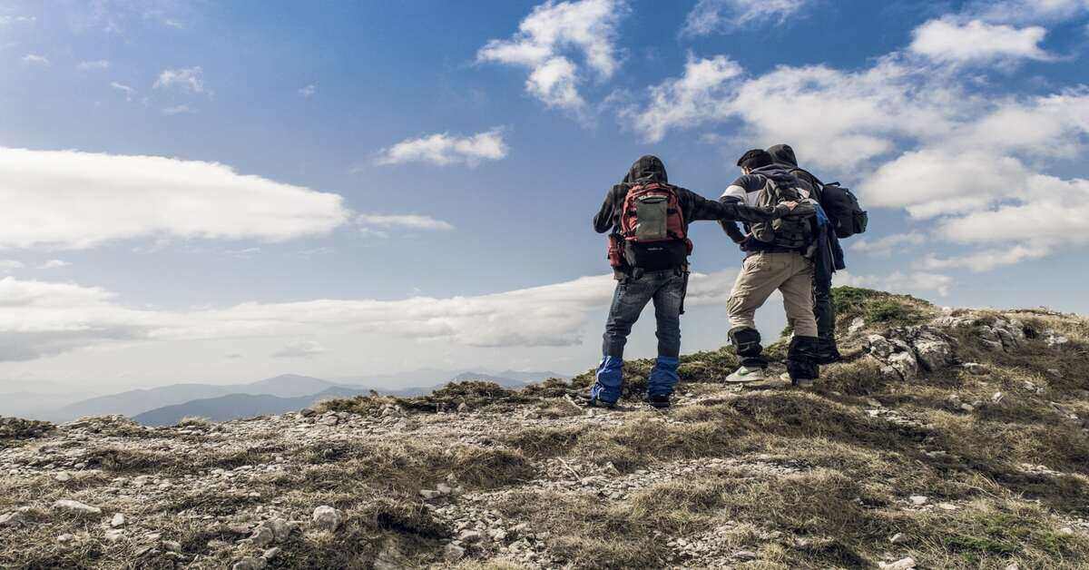 three hikers on a mountain