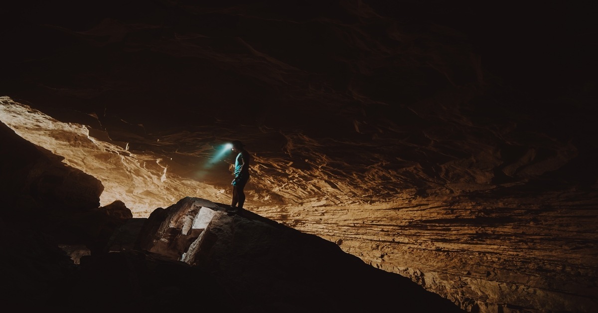 man with headlamp hiking