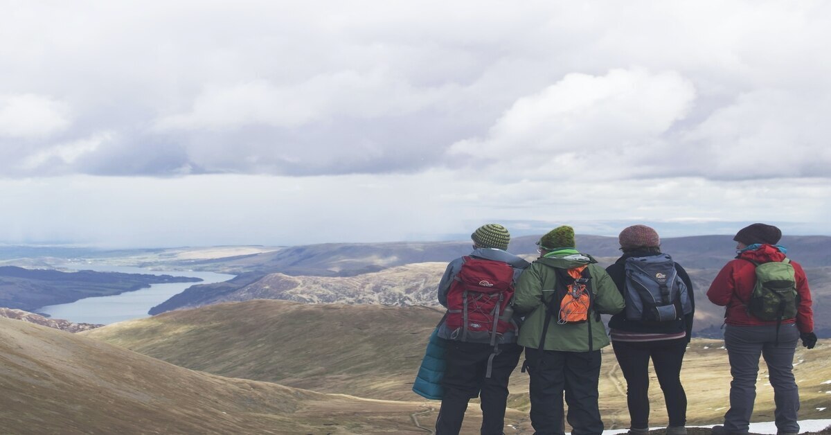 four people hiking