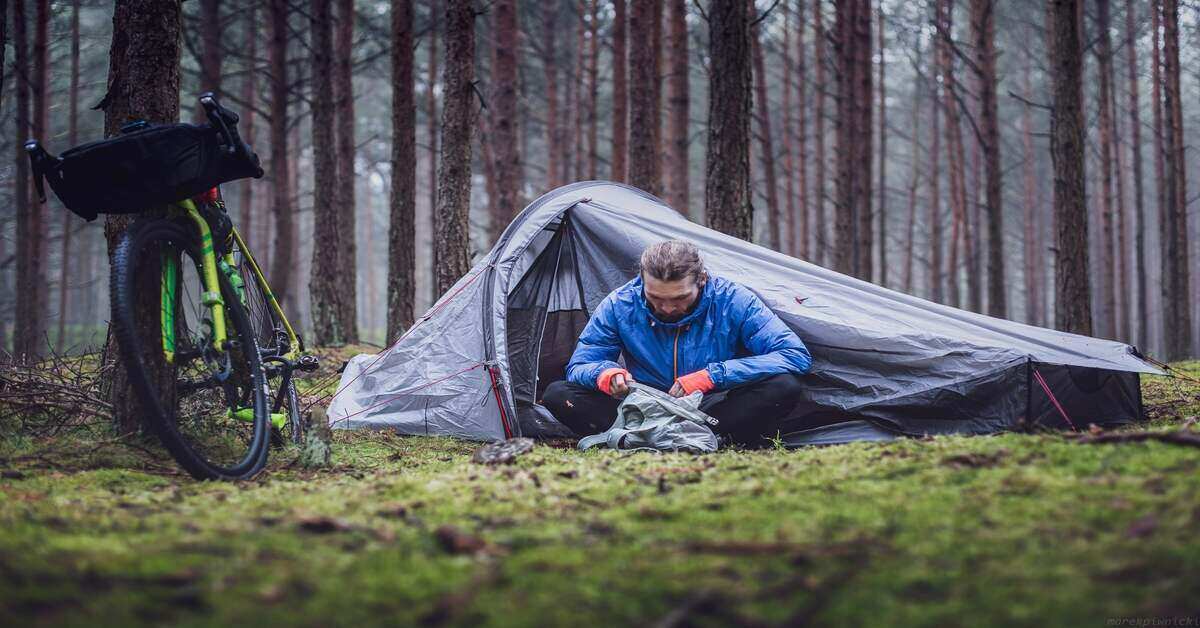 camper in front of a tent