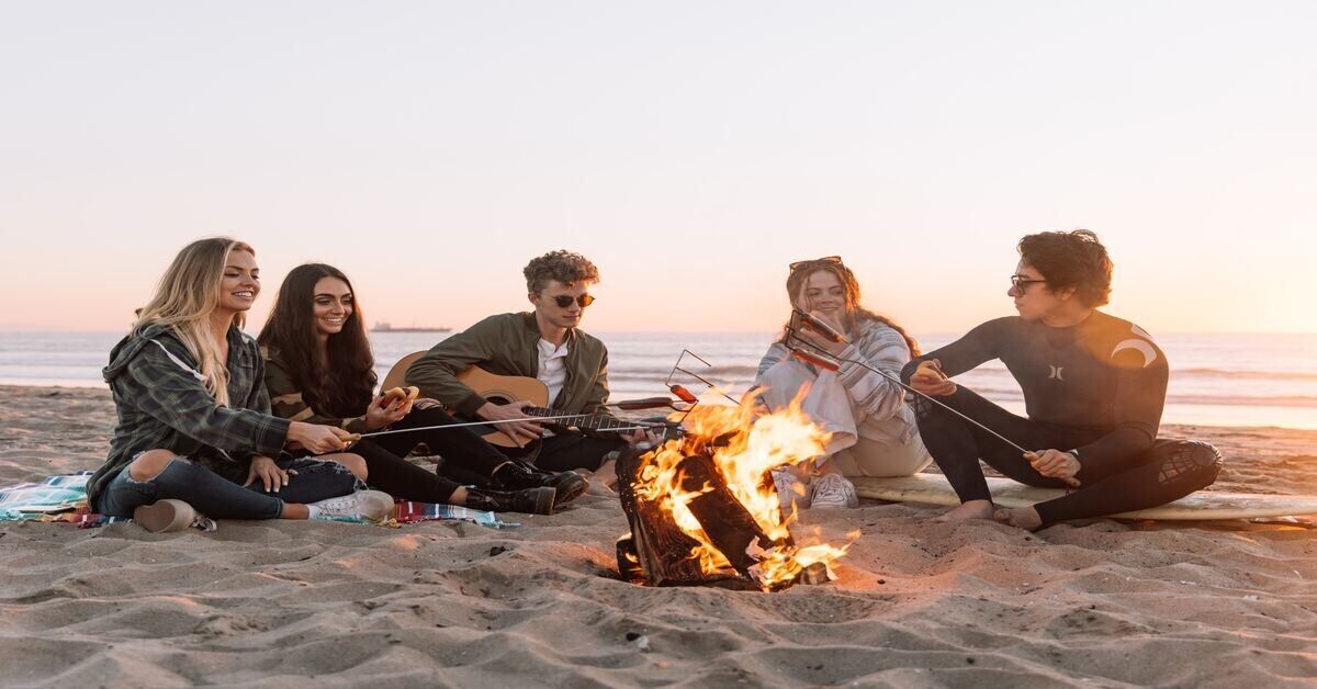 campers seated around a campfire