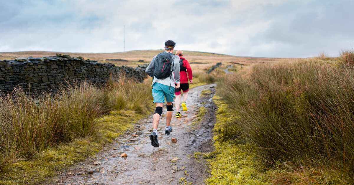 person with knee pads running