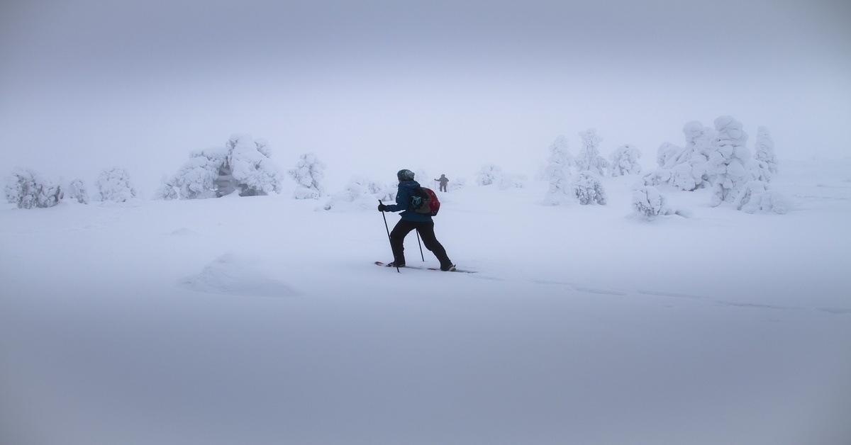 man snowshoeing