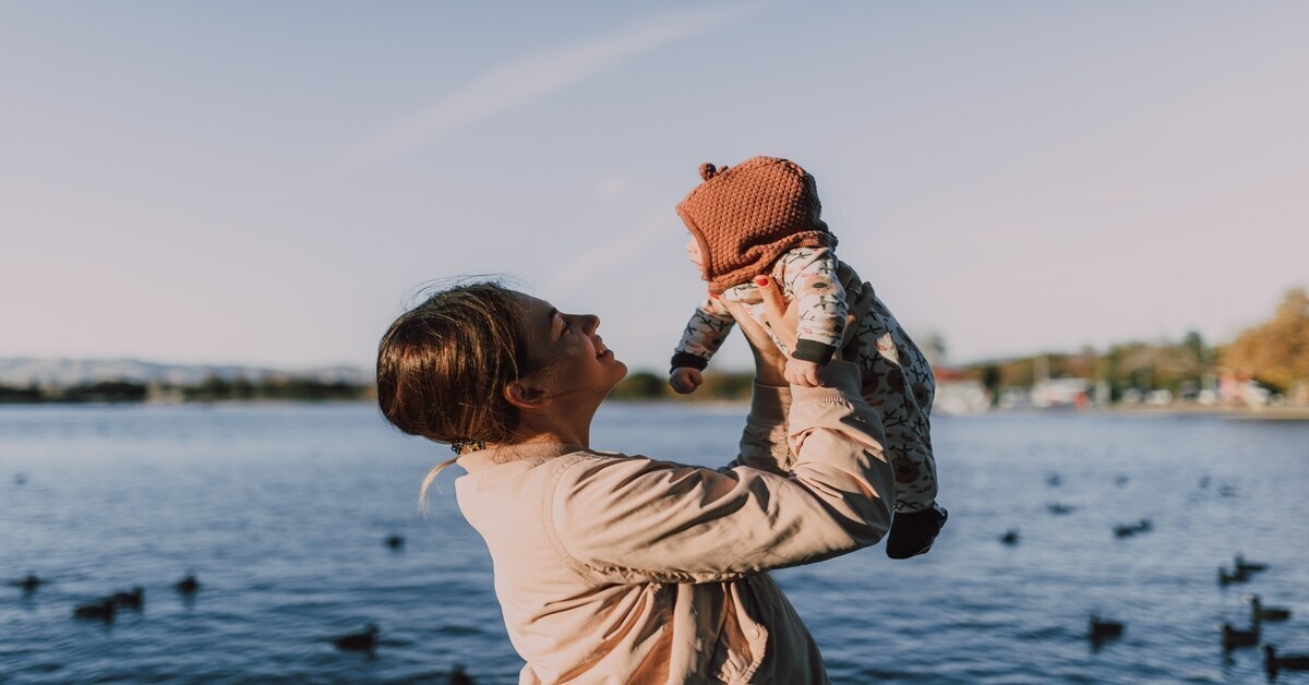 mother holding her child up