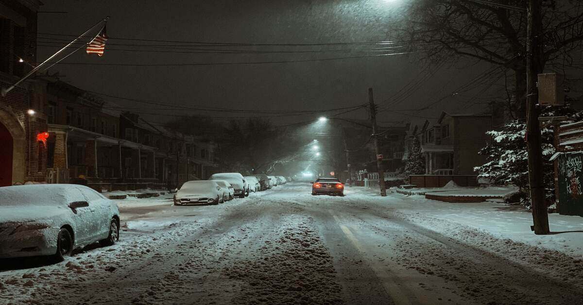 Car in snow at night