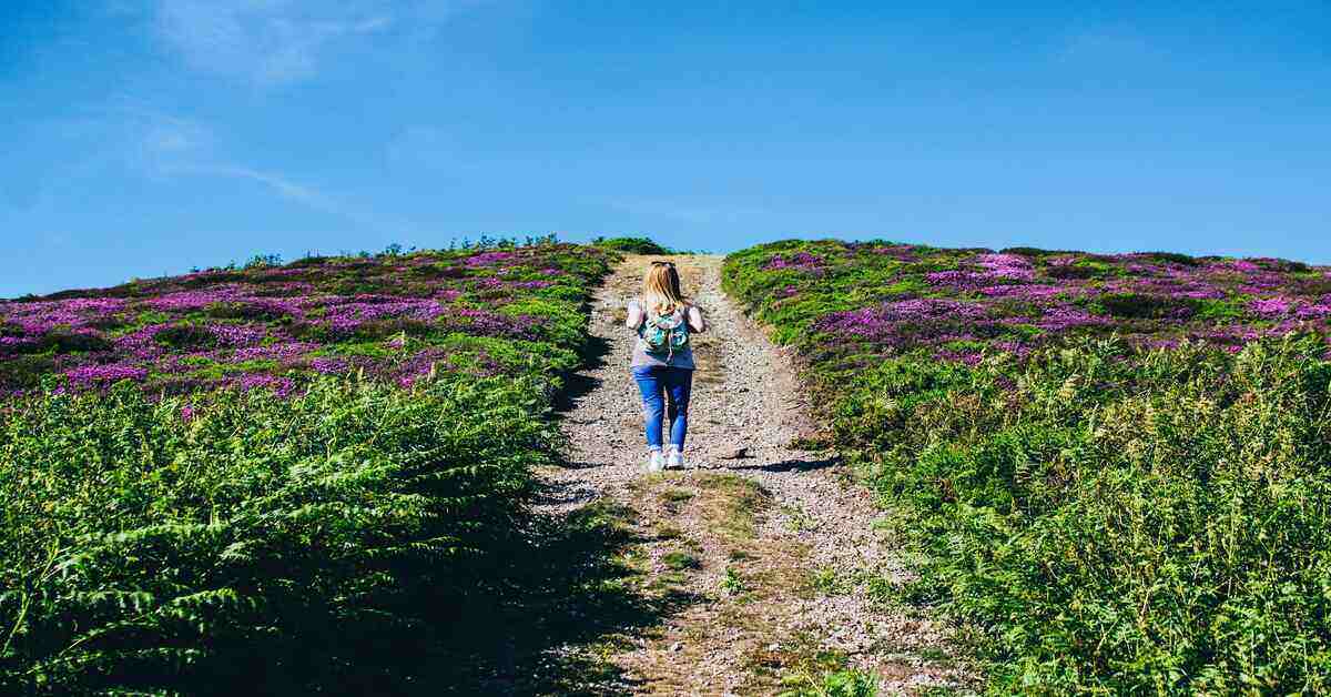 woman walking uphill