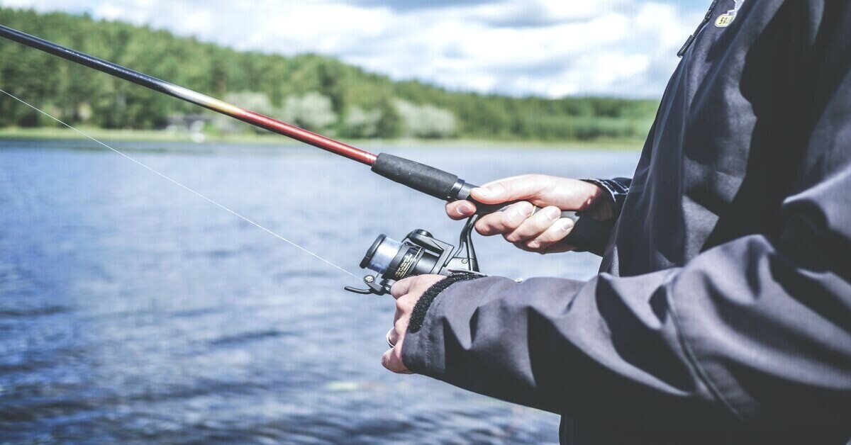 man holding fishing rod