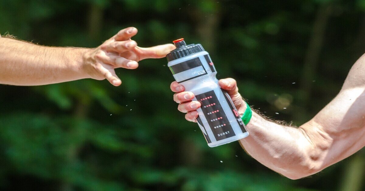 hand holding water bottle