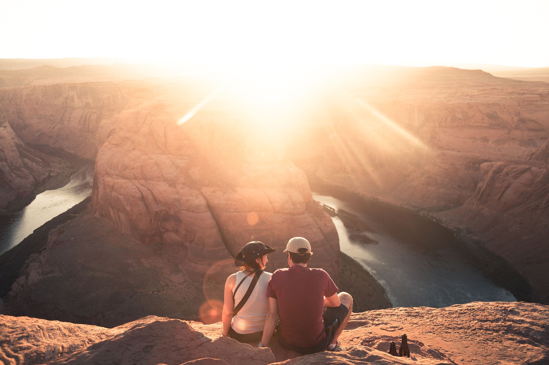 couple seated on rock