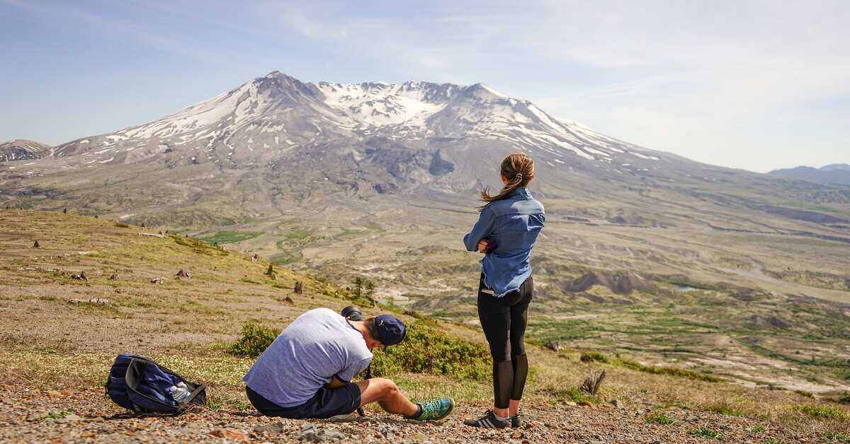 hiking couple near mountain