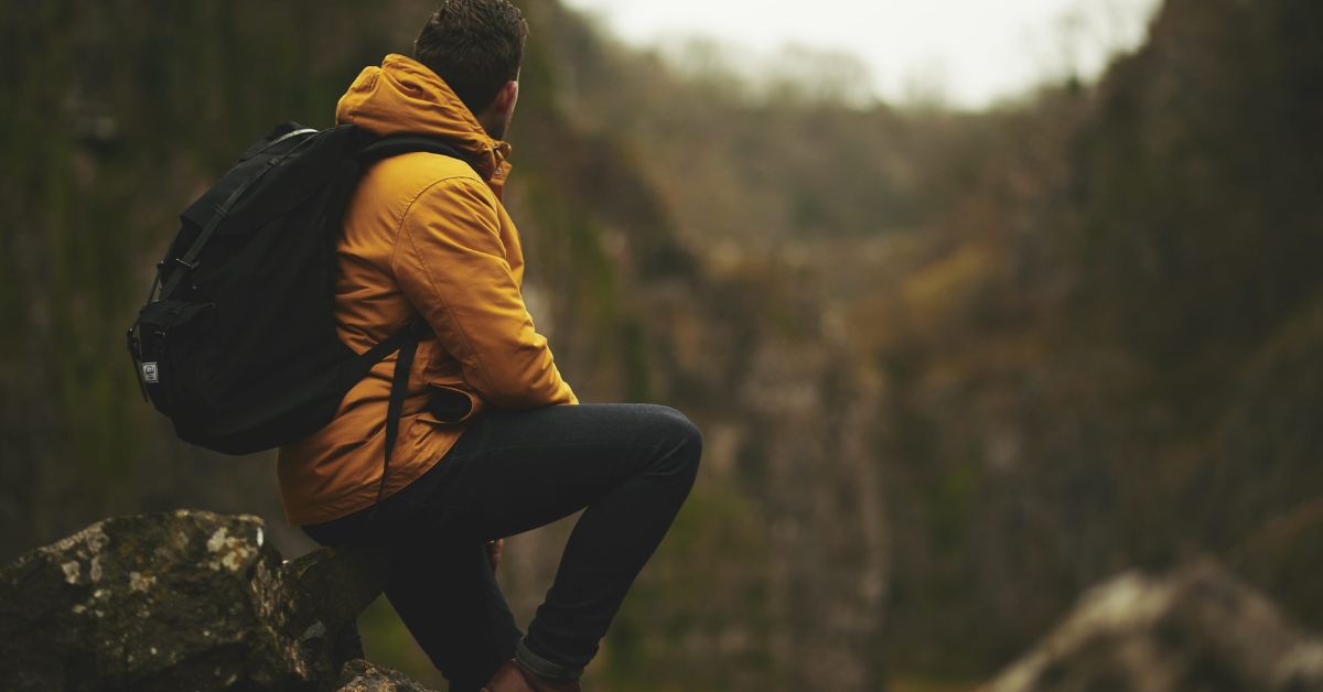 Hiker with backpack staring at the horizon