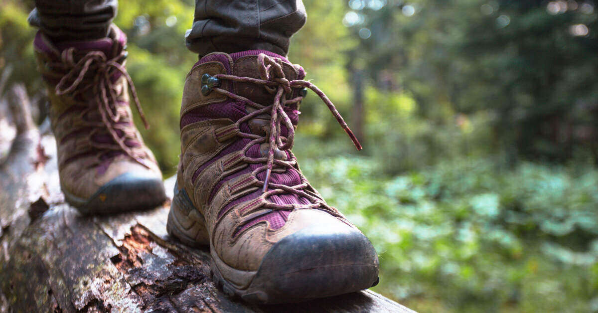 Person wearing Merrell shoes in the woods