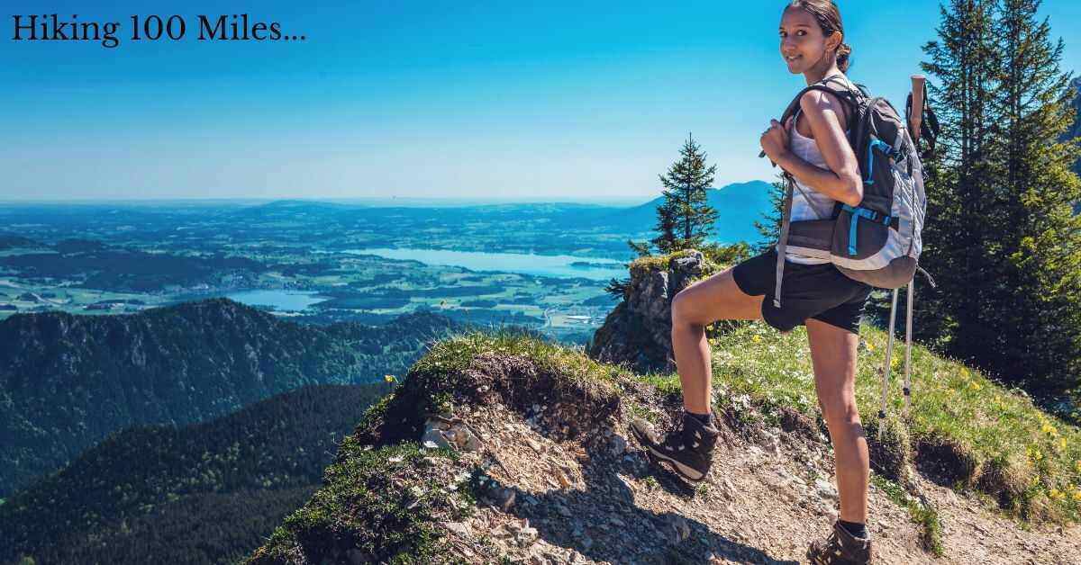 hiker with backpack standing on a cliff