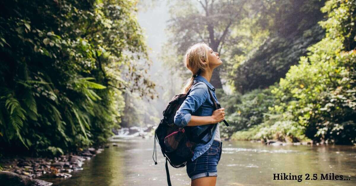 hiker near a water body looking up