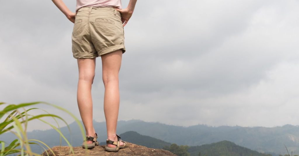 hiker in shorts with Tevas sandals on